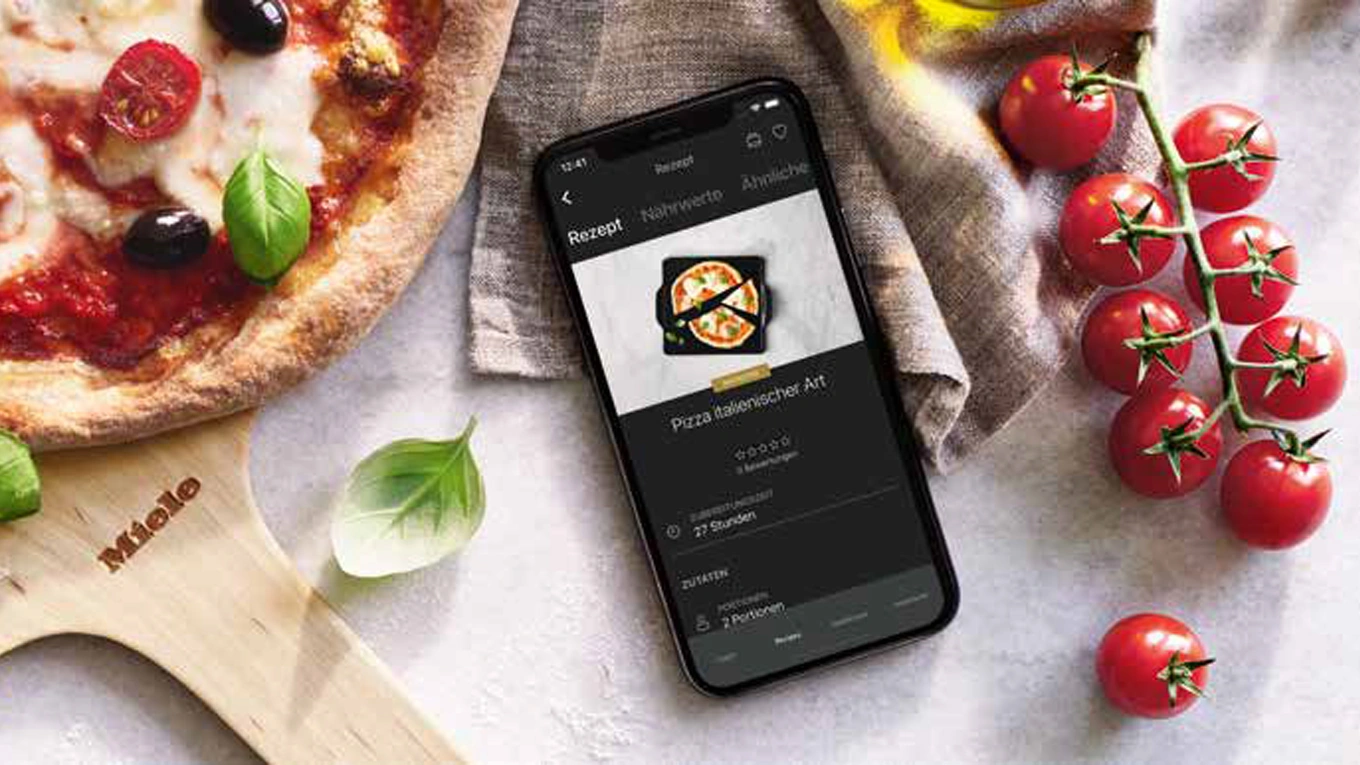 Pizza rezept auf dem display am smartphone in der miele app