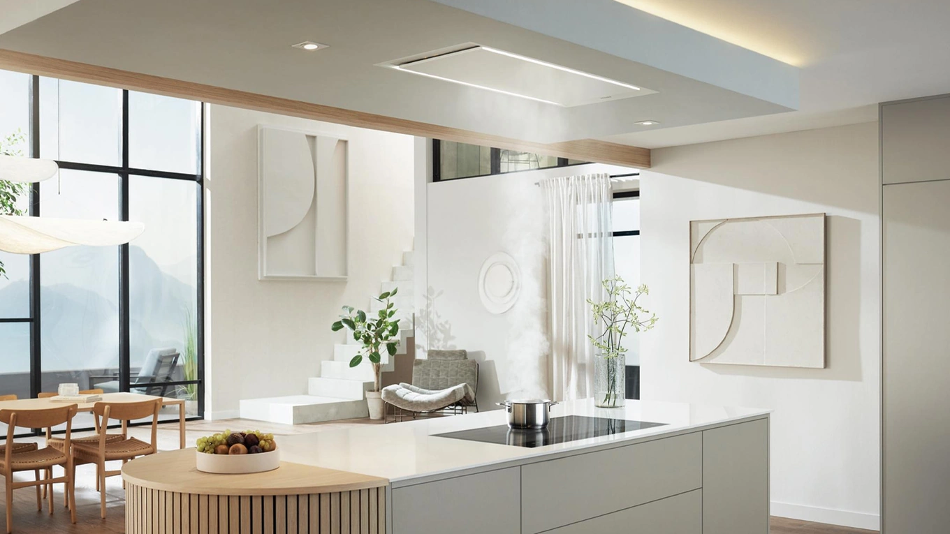 Miele Stella Deckenhaube Miele Stella Deckenhaube in einer Designküche zieht kochdunst aus einem Topf