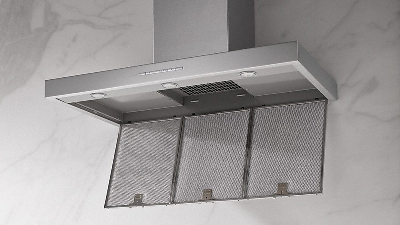 Miele Cleancover Miele dunstabzugshaube mit geöffneter klappe mit sicht auf metallfilter