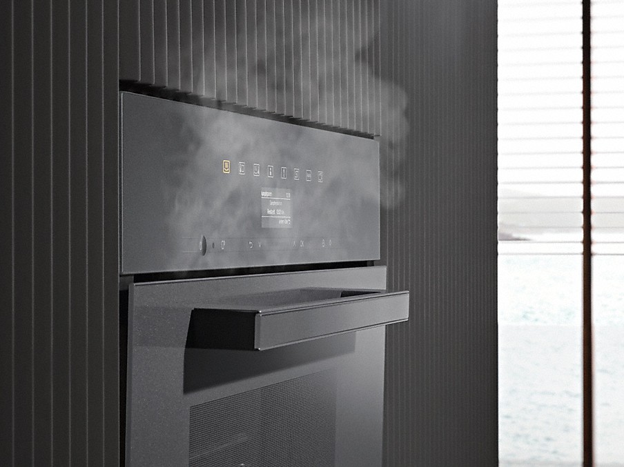 Miele Dampfreduktion aufsteigender dampf aus einem seitlich dargestellten miele dampfgarer